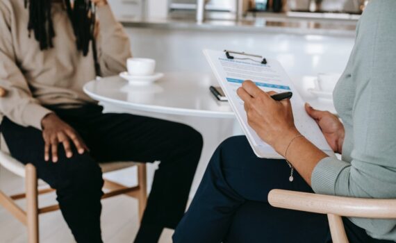crop faceless multiethnic interviewer and job seeker going through interview