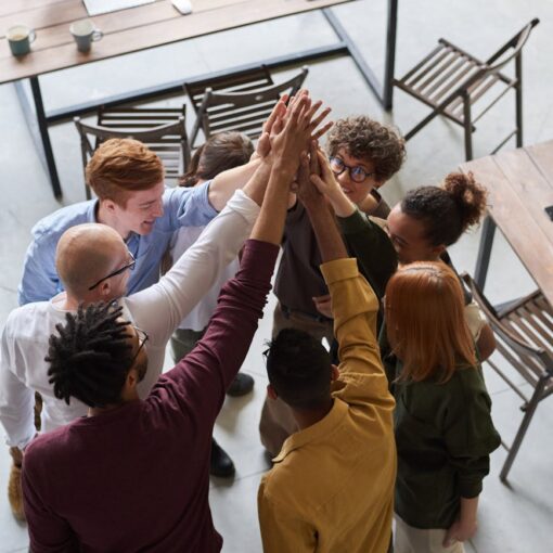 photo of people holding each other s hands