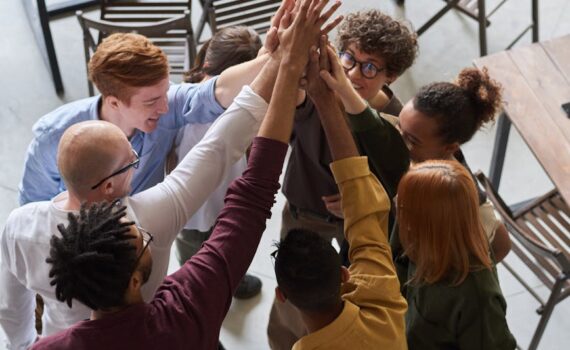 photo of people holding each other s hands